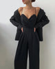 Ärmelloser Jumpsuit mit hoher Taille und weiten Beinen
